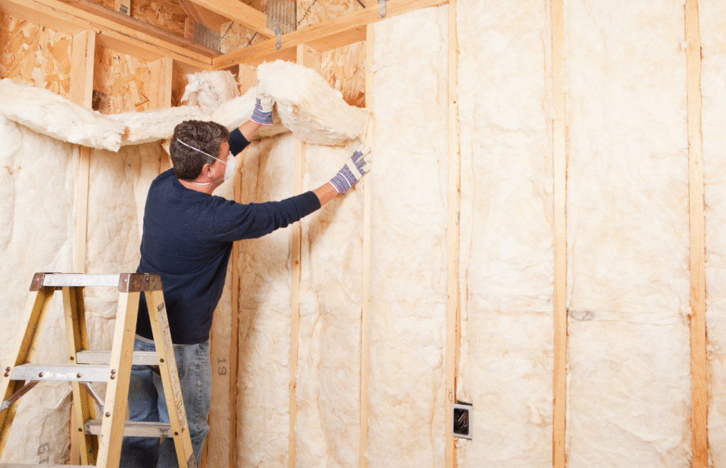 Participants learning energy-efficient cavity wall insulation methods.