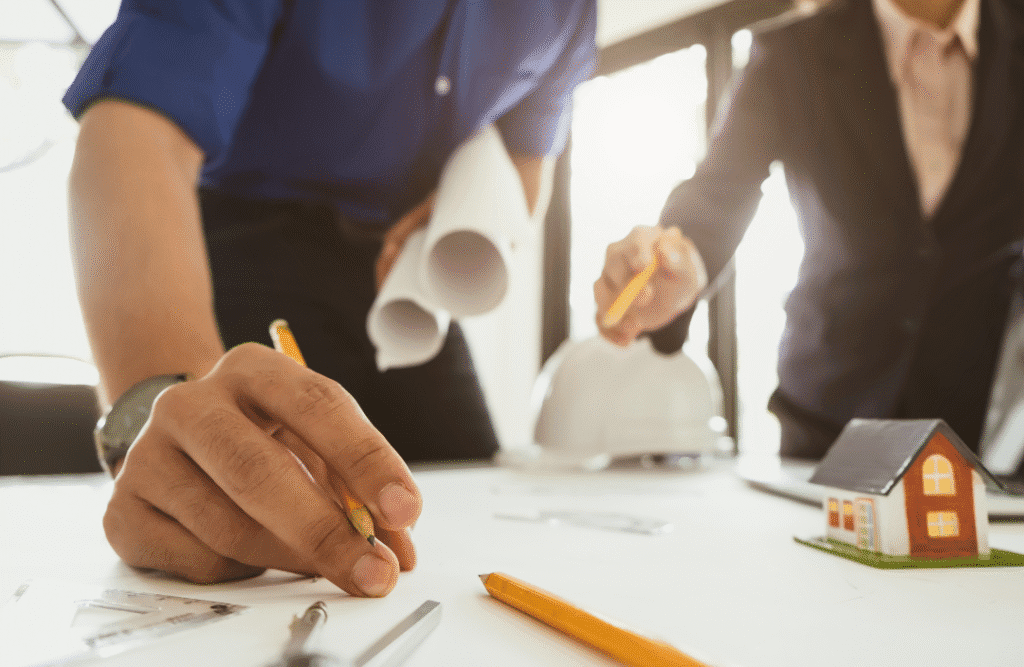Professional installer using advanced techniques for internal wall insulation in a commercial building.